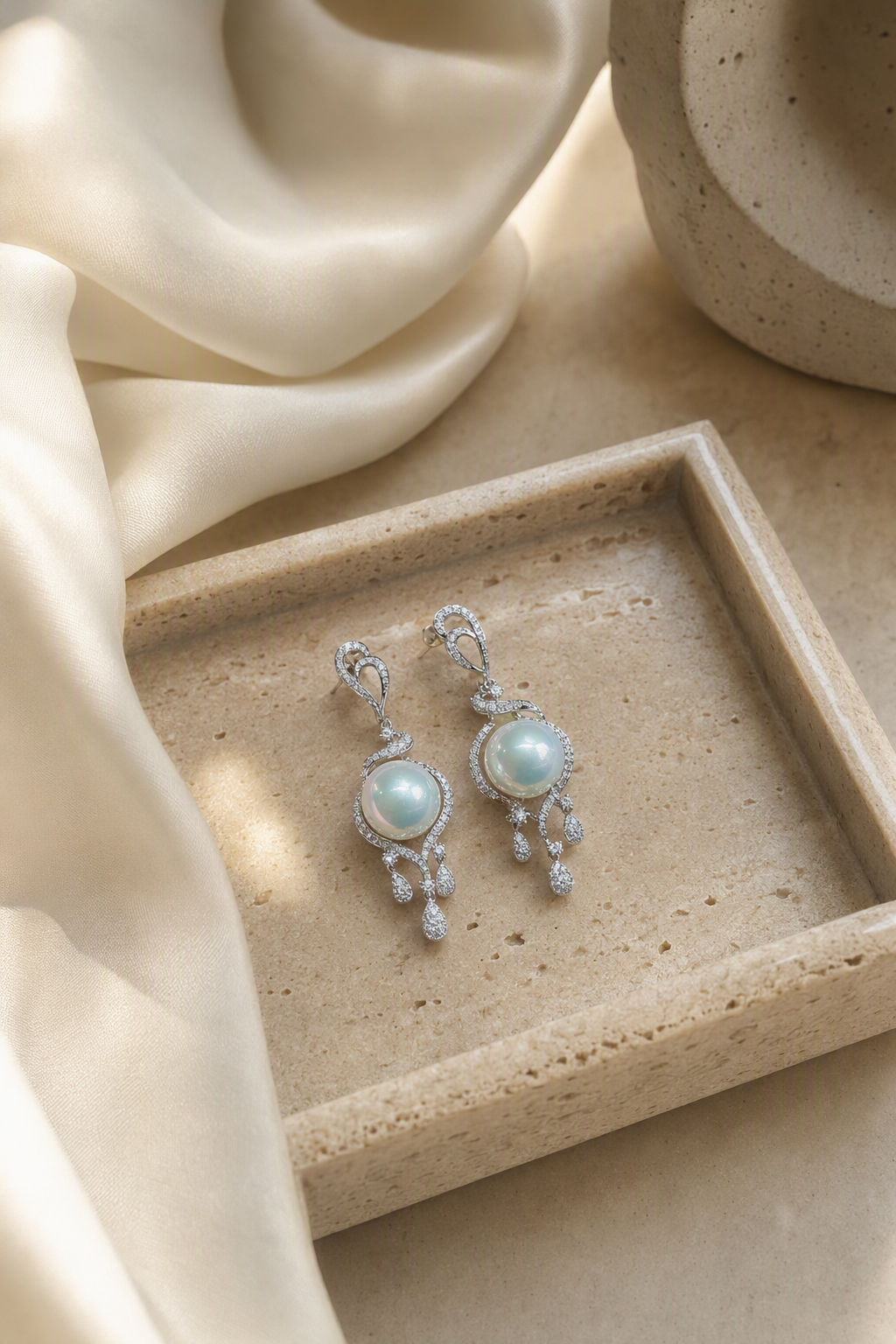 Venus Luster 11-12mm Australian South Sea Pearl stud earrings in an elegant still-life luxury setting