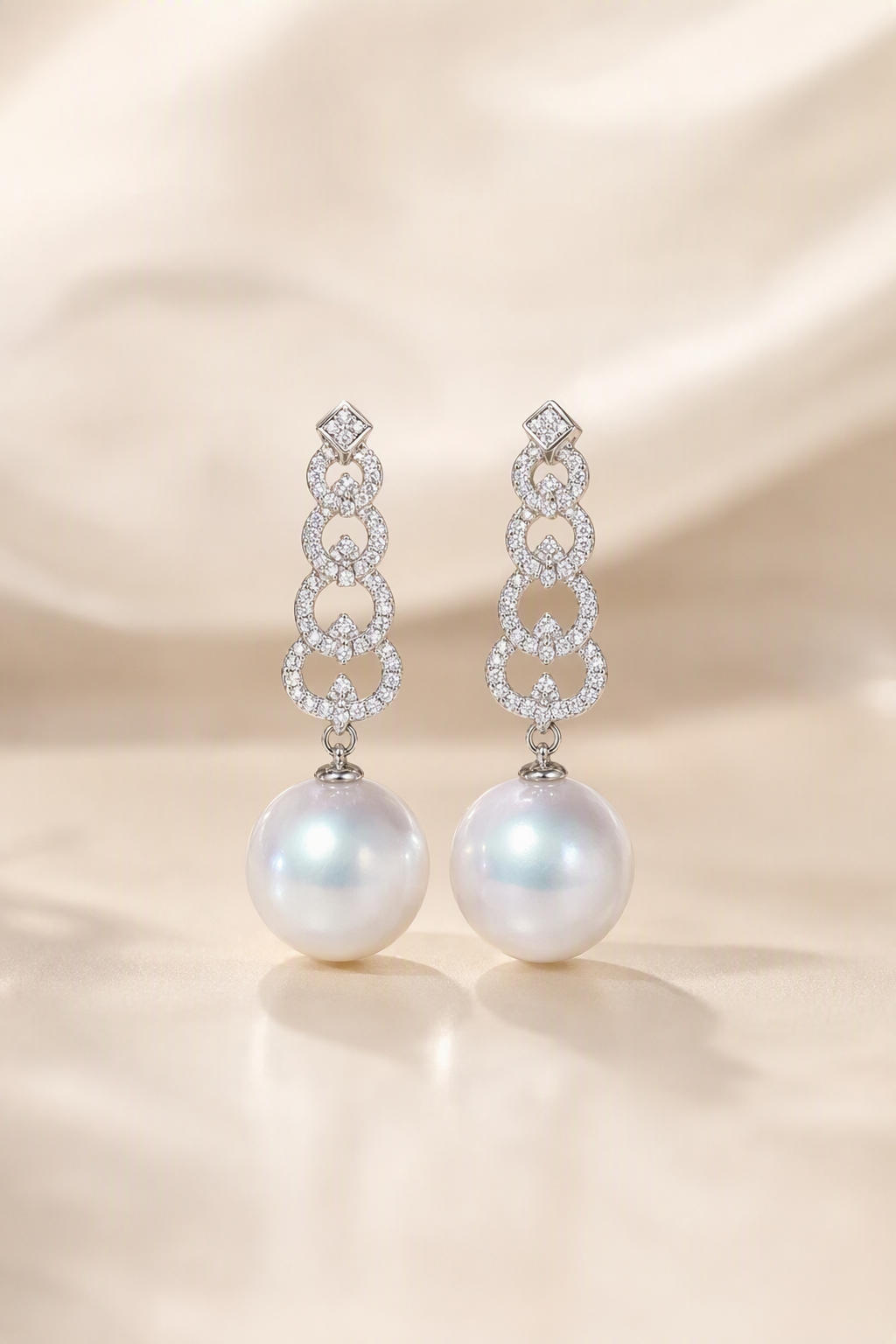 Venus Luster 12-13mm Australian South Sea Pearl Stud Earrings on a cream white primary background