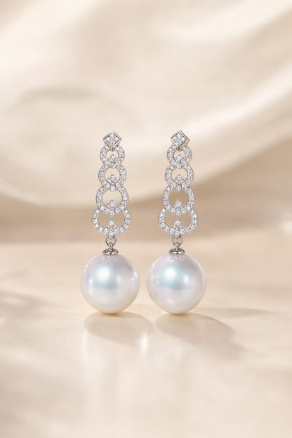 Venus Luster 12-13mm Australian South Sea Pearl Stud Earrings on a cream white primary background