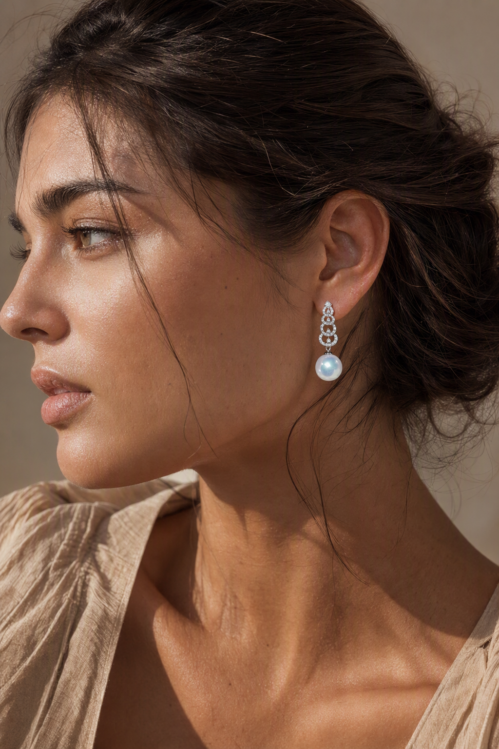 Venus Luster 12-13mm Australian South Sea Pearl Stud Earrings naturally worn on the earlobe by a model