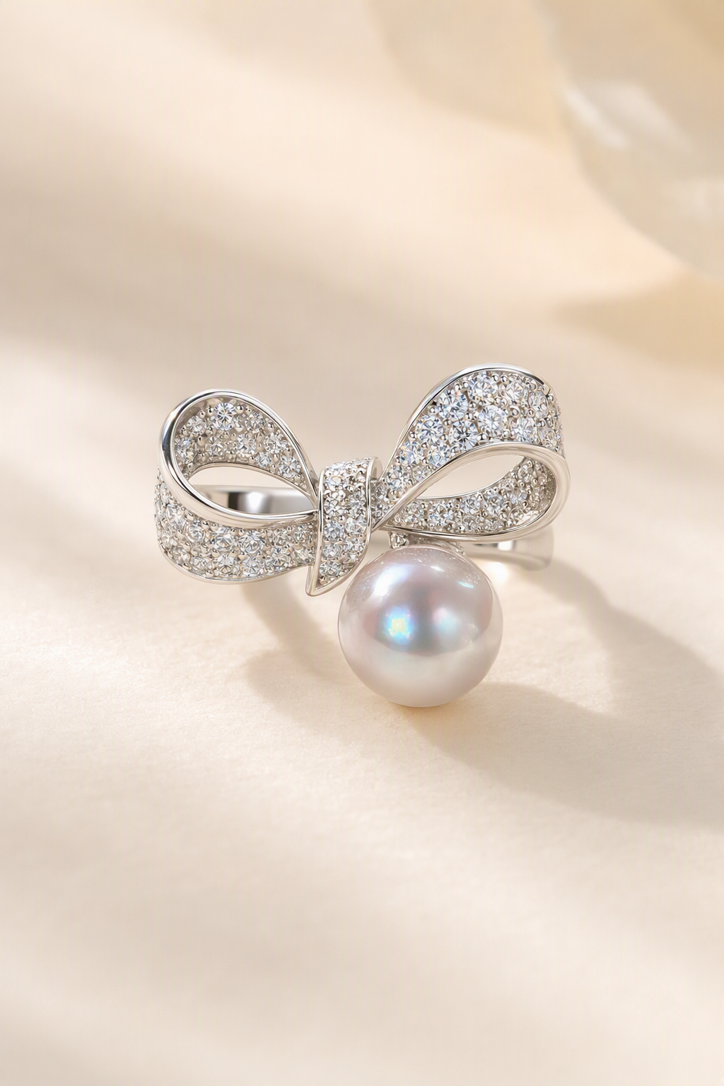 Venus Luster 9-10mm Australian South Sea Pearl Bow Ring on a cream white primary background