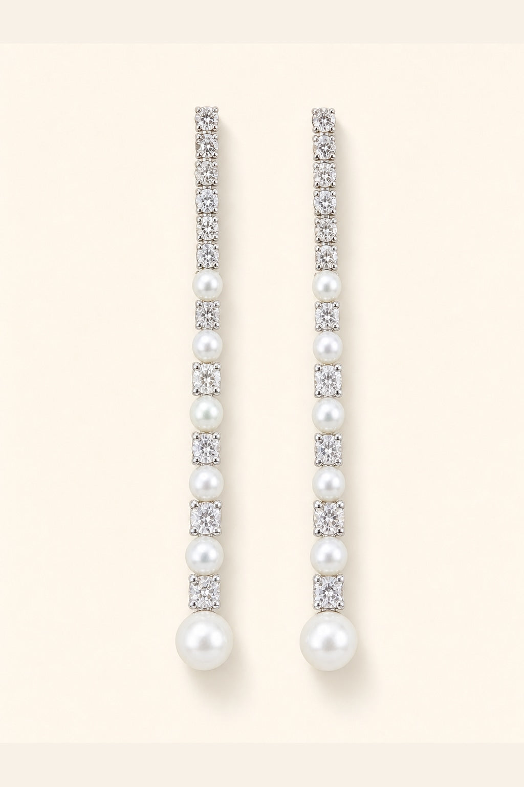 White freshwater pearl meteor earrings with mirror-like luster and silver crystal details