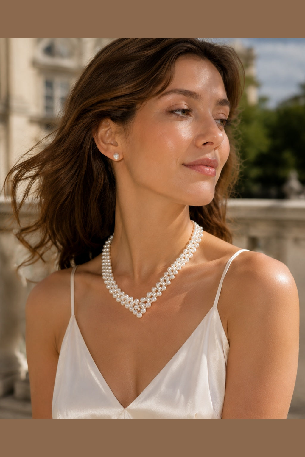 woman wearing a woven freshwater pearl necklace with layered pearl strands